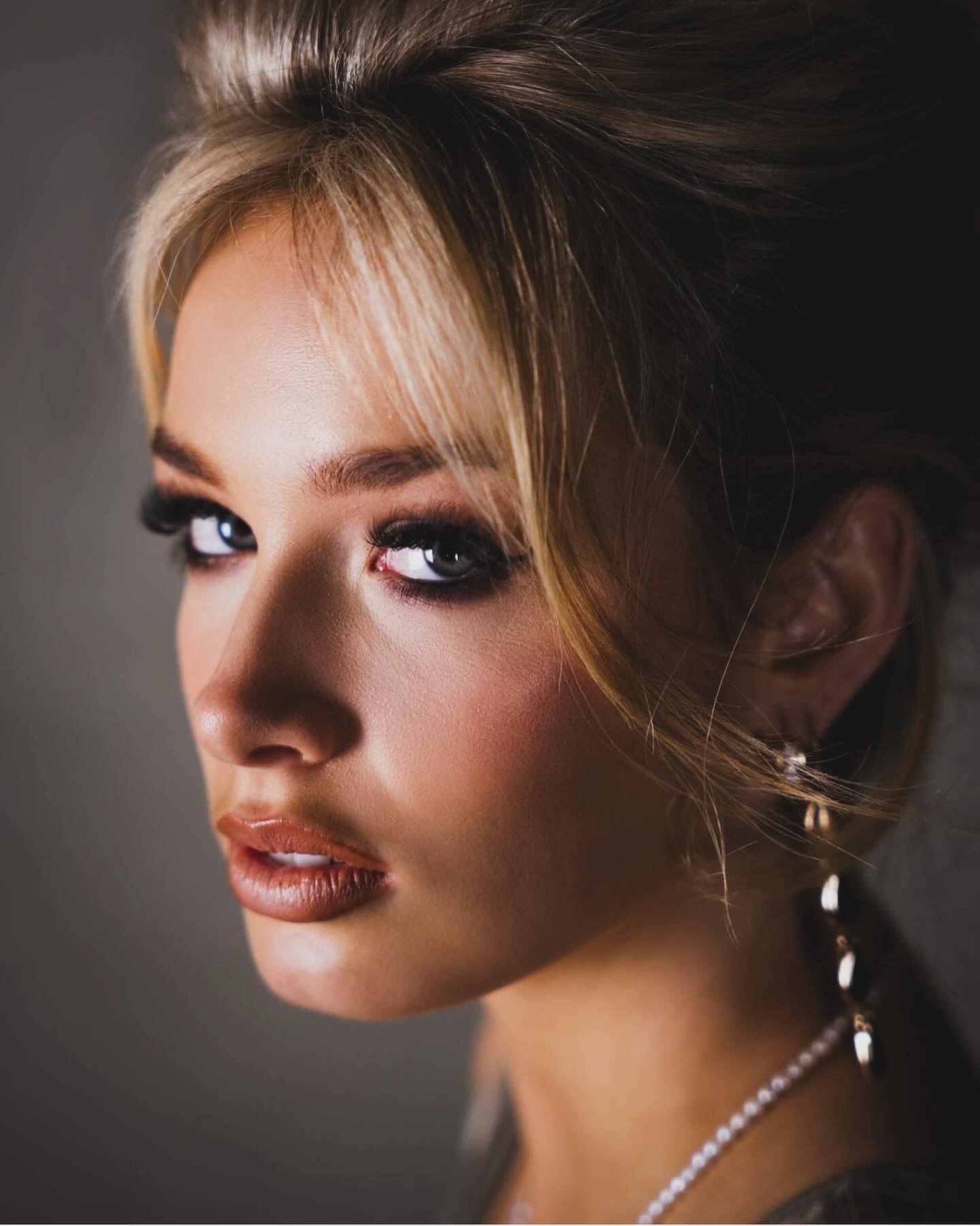 Blonde beauty portrait with a softly structured updo