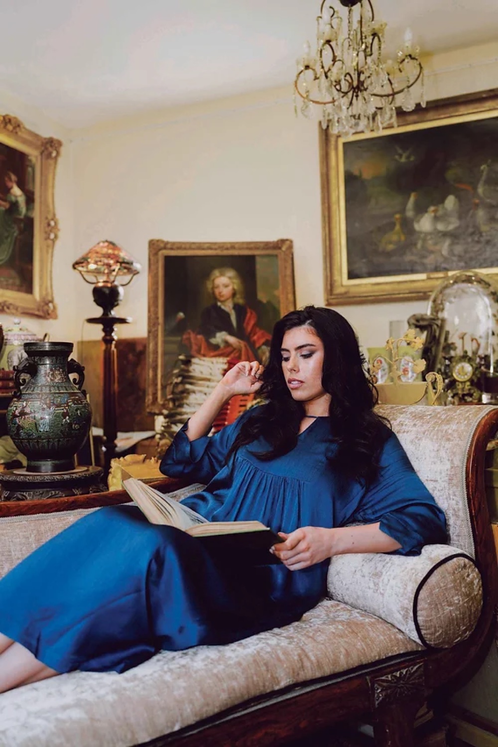Brunette model in a richly layered editorial interior
